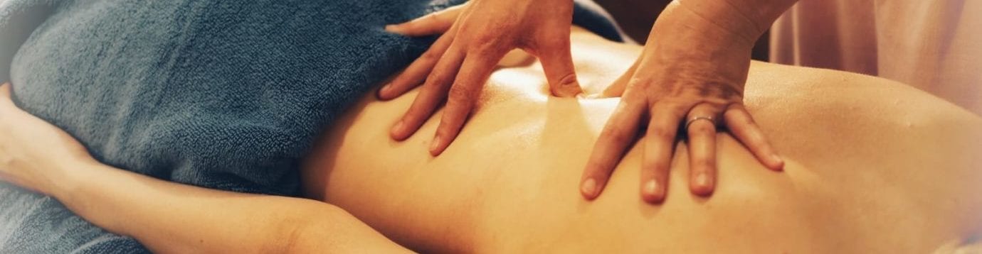 photo of manual therapy on a patients back